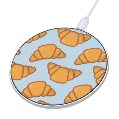 Wireless charging pad with croissant pattern on a light blue background | Casenari