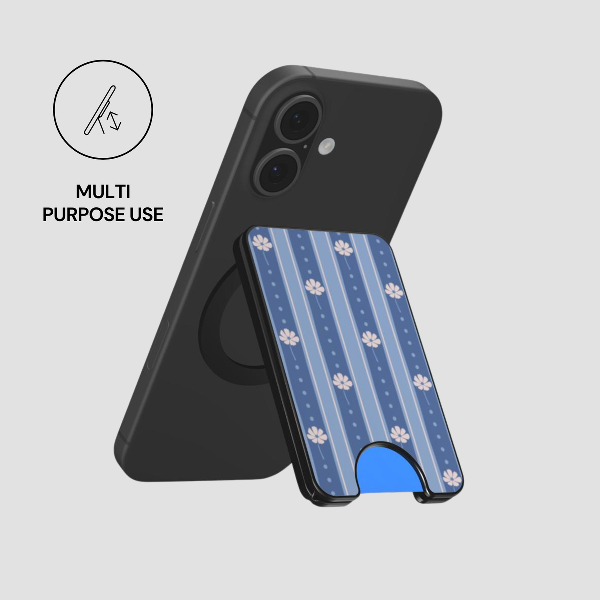 A black phone case shown on a smartphone, with a detachable blue patterned card holder case in front. The card holder has vertical blue stripes, small white floral motifs, and a blue kickstand base.