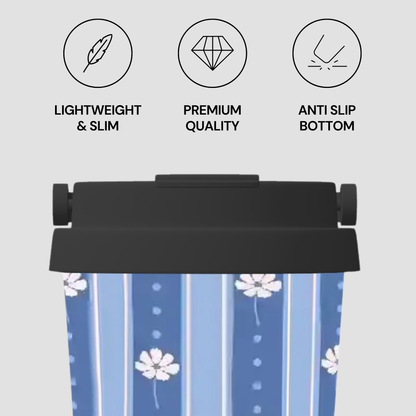 A blue and white striped insulated tumbler with a black lid, shown against a light gray background with three feature icons and text reading 'LIGHTWEIGHT & SLIM', 'PREMIUM QUALITY', and 'ANTI SLIP BOTTOM'.
