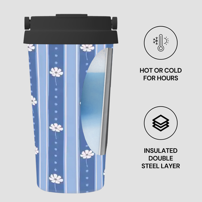 A blue patterned travel tumbler with a black lid, shown on a light gray background with feature icons and text reading 'HOT OR COLD FOR HOURS' and 'INSULATED DOUBLE STEEL LAYER'.