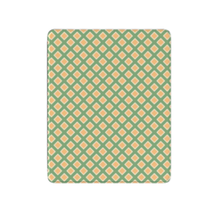 Patterned green and orange rug on a white background