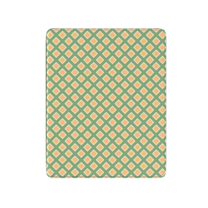 Patterned green and orange rug on a white background