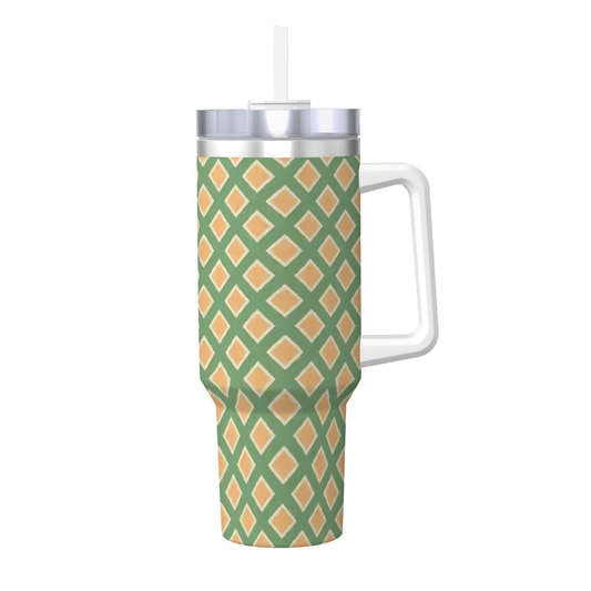 Tumbler with green and orange pattern on a white background