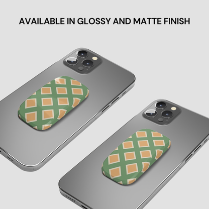 Two phone cases with green and orange pattern on a gray background