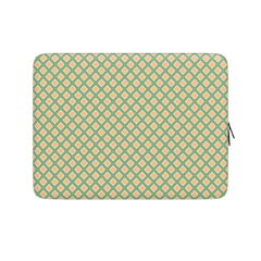 Laptop sleeve with green and orange geometric pattern on a white background