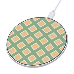 Round wireless charging pad with green and beige checkered pattern on a white background