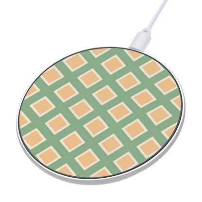 Round wireless charging pad with green and beige checkered pattern on a white background