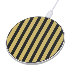Round wireless charging pad with black and gold striped design on a white background