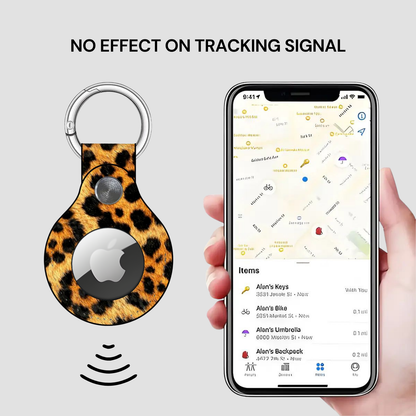 Leopard print tracker with Apple logo on a gray background, held by a hand with a smartphone displaying a location app.
