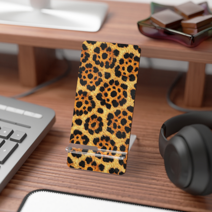 Phone case with leopard print on a desk with keyboard and headphones