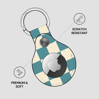 Checkered patterned keychain case with Apple logo on a light gray background