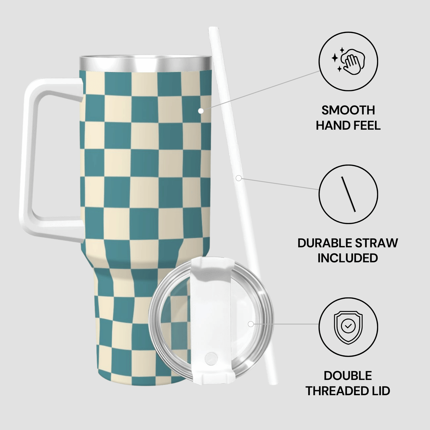 Checkered travel mug with lid and straw on a light gray background