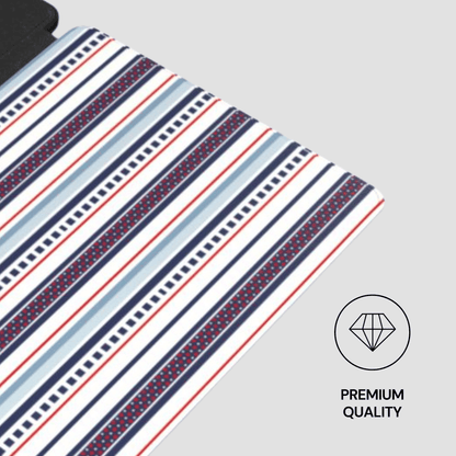 Striped fabric with red, blue, and white pattern on a gray background