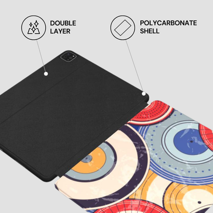 Black tablet case with polycarbonate shell and double layer features on a colorful abstract background