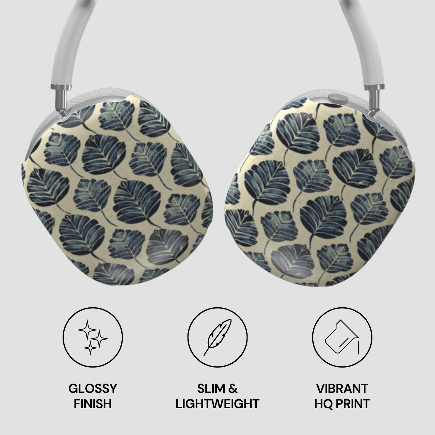 Headphones with leaf patterned case on a light gray background