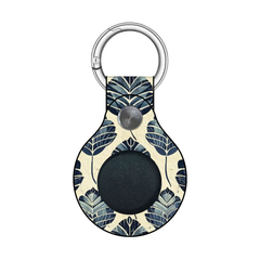 Keychain with floral pattern and black circular component on a white background