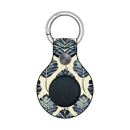 Keychain with floral pattern and black circular component on a white background