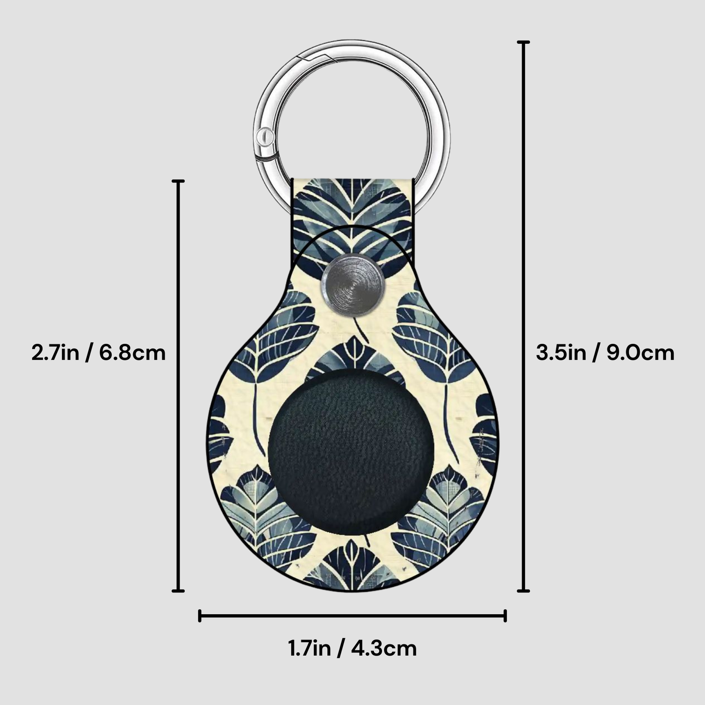 Keychain with leaf pattern and measurements on a gray background
