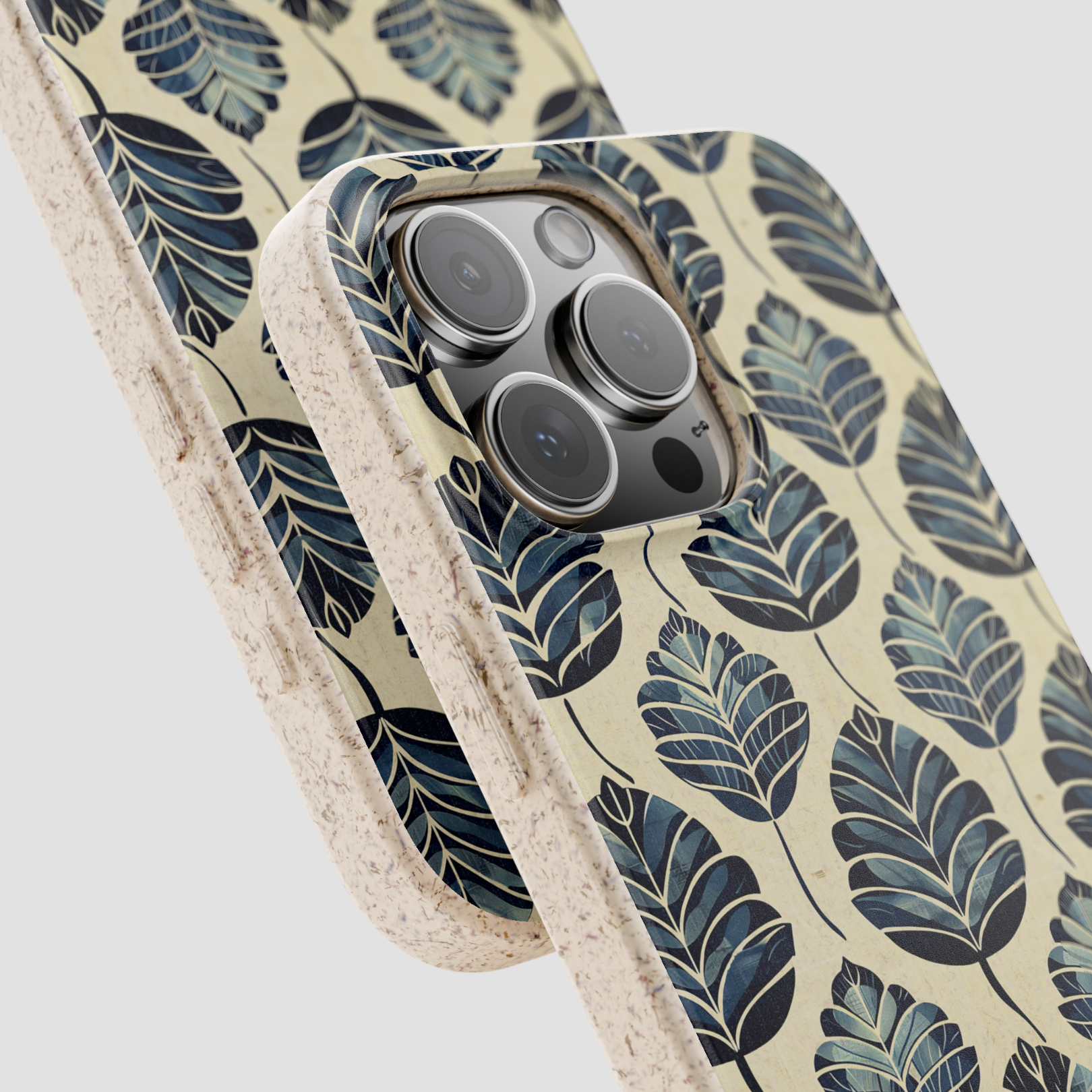 Phone case with leaf pattern on a light background