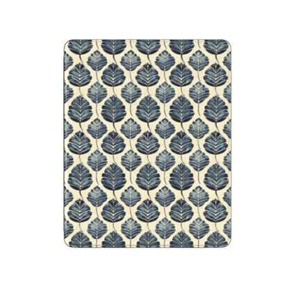 Patterned mouse pad with blue leaf design on a beige background