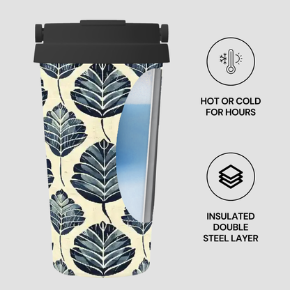 Insulated tumbler with leaf pattern on a light gray background