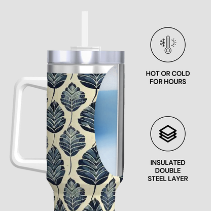 Insulated tumbler with leaf pattern on a white background