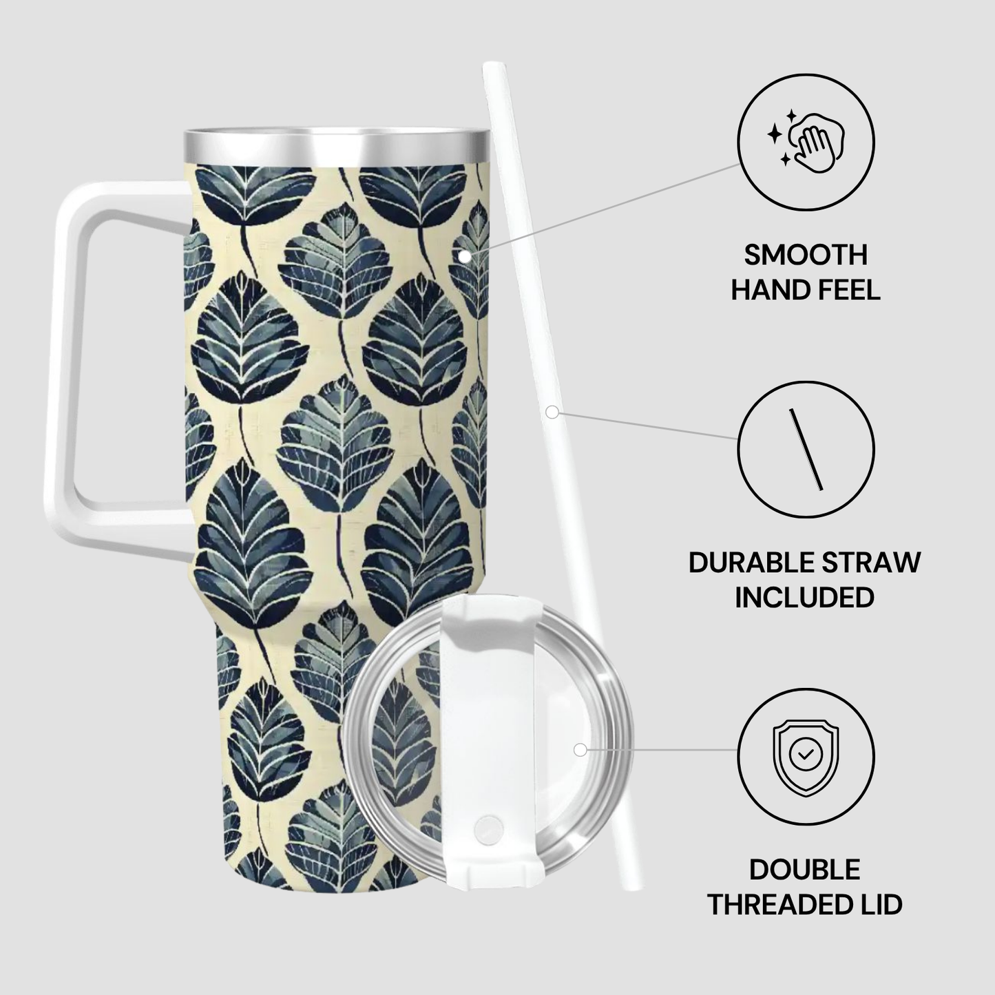 Tumbler with leaf pattern, lid, and straw on a light gray background