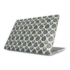 Laptop with black and white polka dot design on a white background