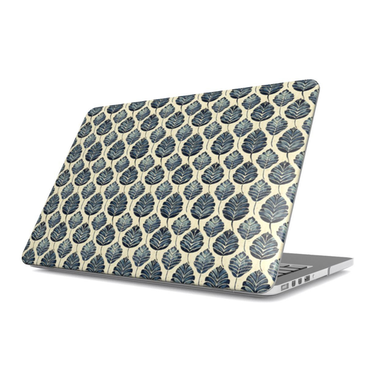Laptop with black and white polka dot design on a white background