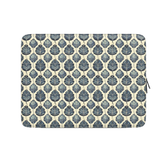 Laptop sleeve with blue leaf pattern on a beige background