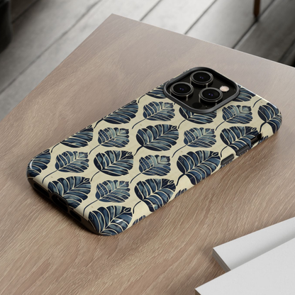 Phone case with leaf pattern on a wooden surface
