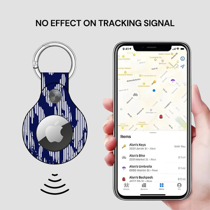 Keychain tracker with smartphone app showing location tracking on a gray background