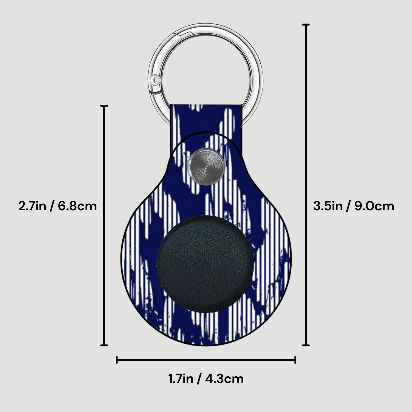 Keychain with measurements on a gray background