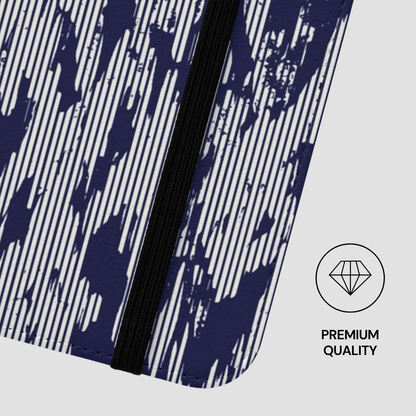 Close-up of a notebook with a blue and white striped pattern on a white background, featuring a 'Premium Quality' label.