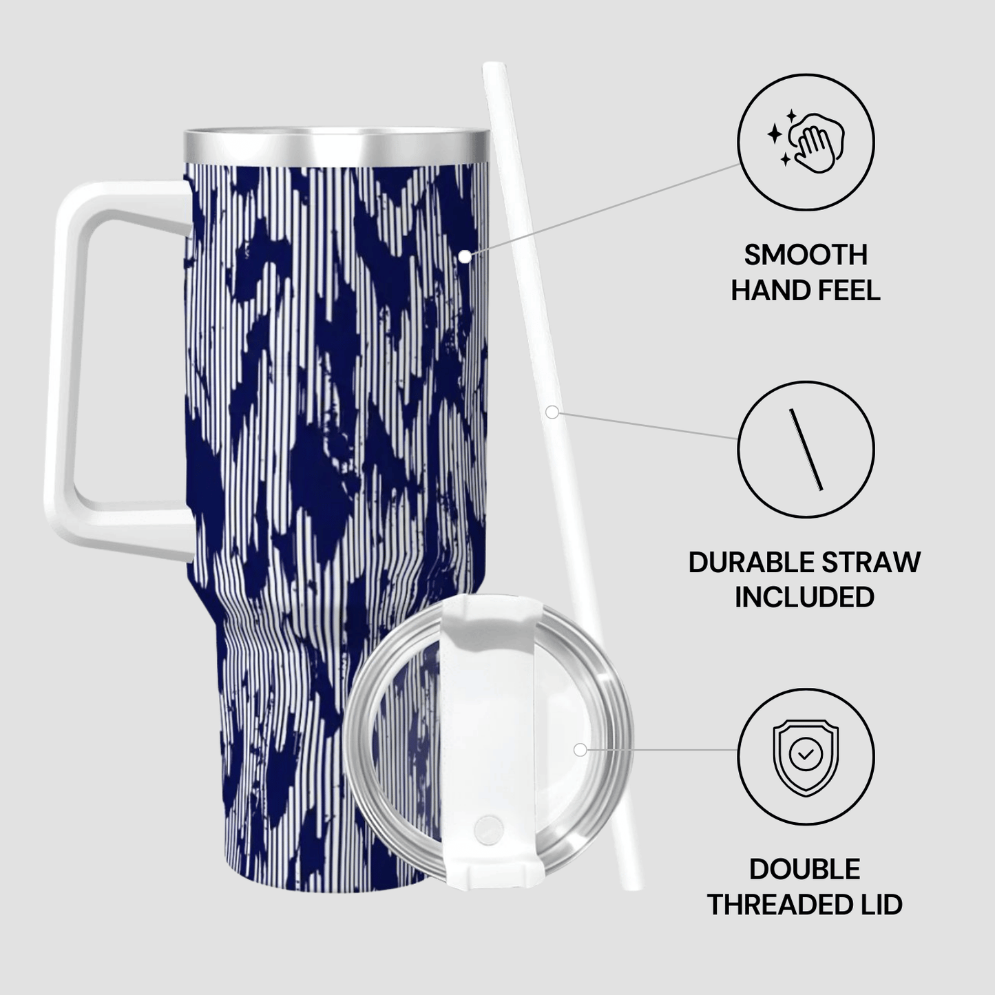 Travel mug with blue and white pattern, straw, and lid on a light gray background