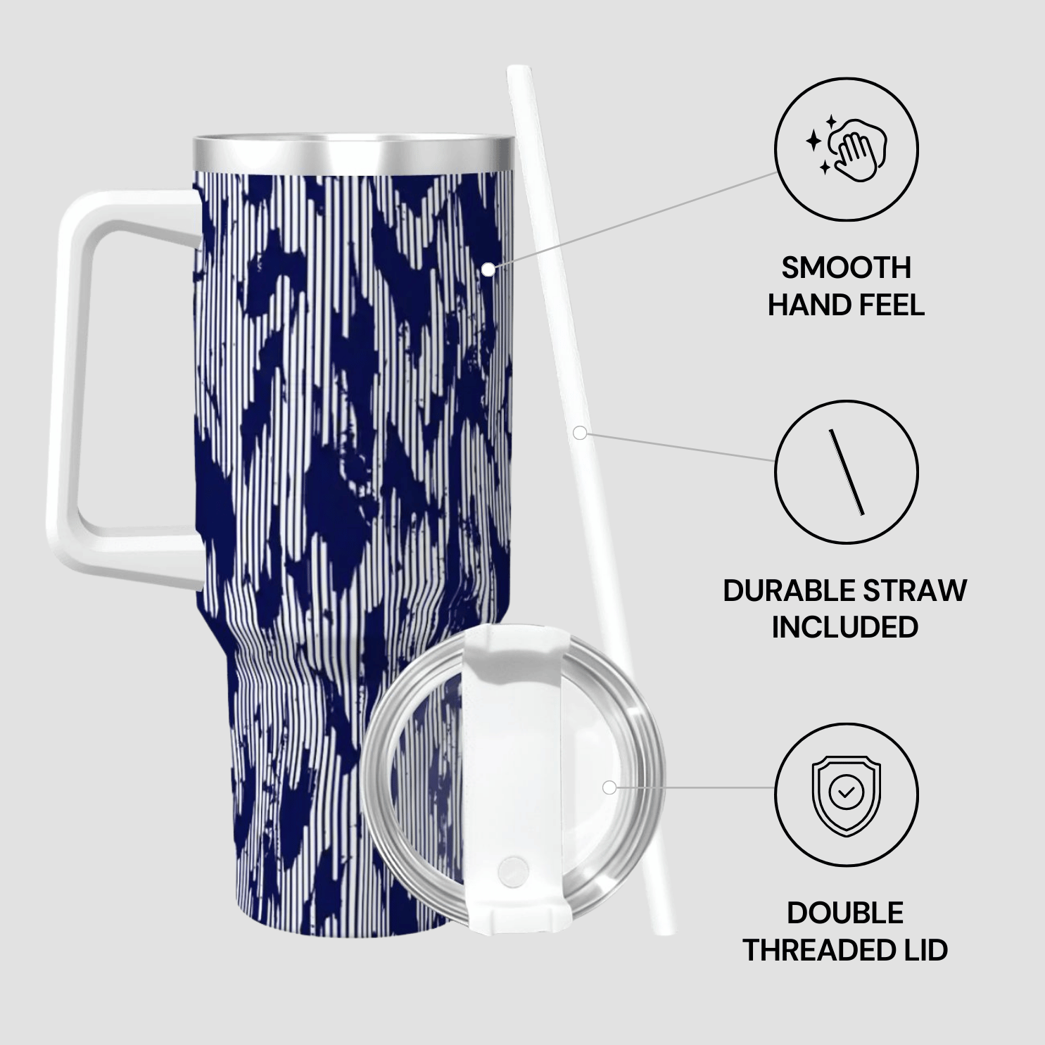 Travel mug with blue and white pattern, straw, and lid on a light gray background