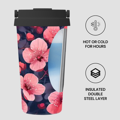 Insulated tumbler with pink floral design on a white background