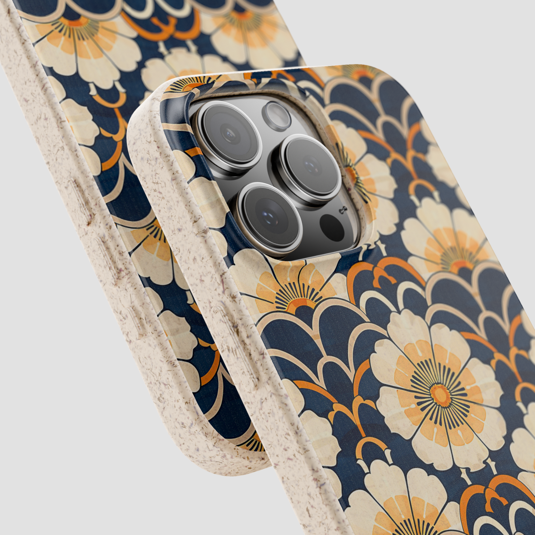 Floral patterned phone case with beige border on a light gray background