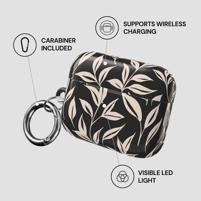 Black and beige floral patterned case with carabiner, wireless charging support, and visible LED light on a gray background.