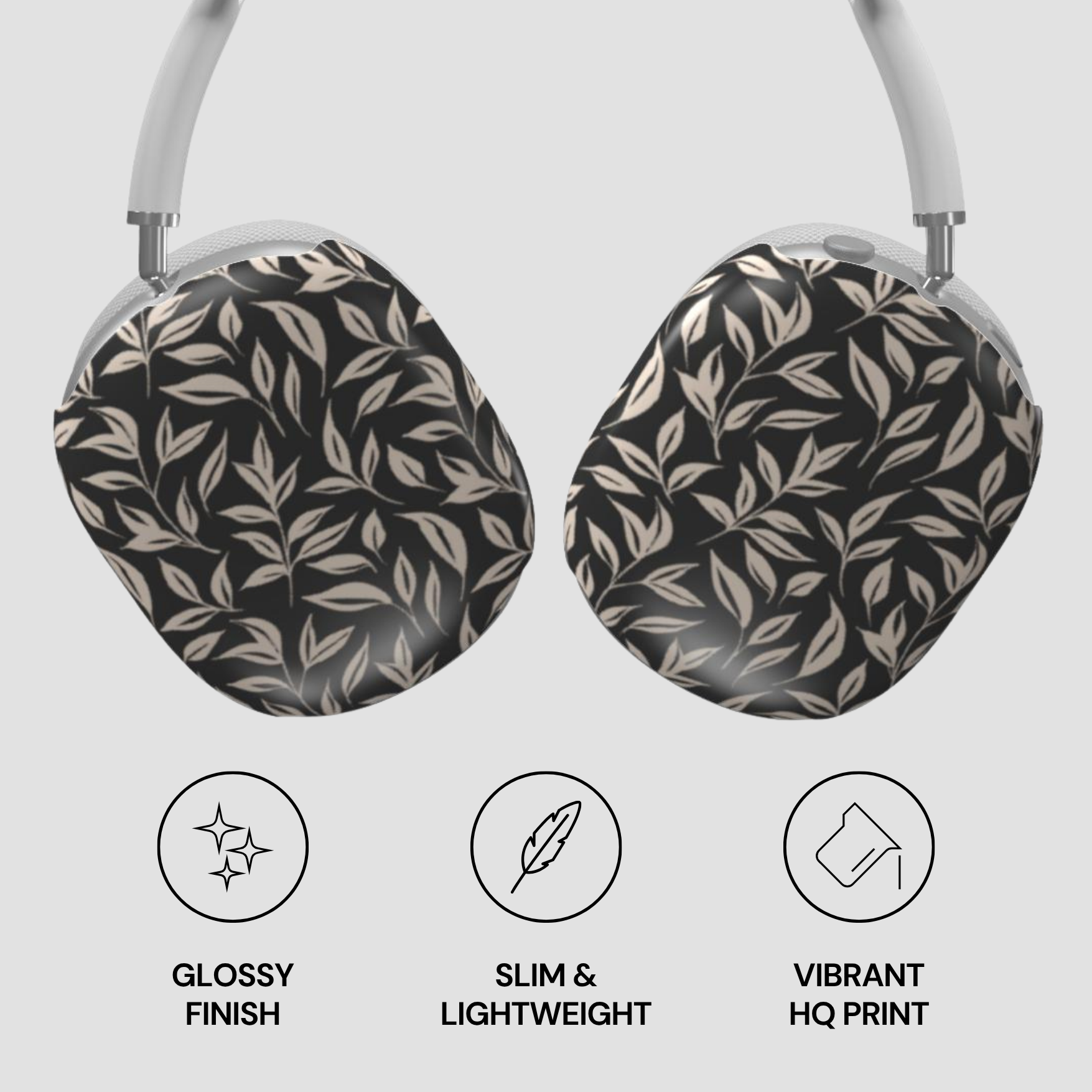 Headphones with leaf patterned ear covers on a light gray background