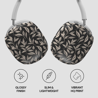 Headphones with leaf patterned ear covers on a light gray background