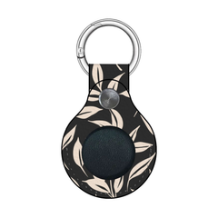Keychain case with leaf pattern on a white background