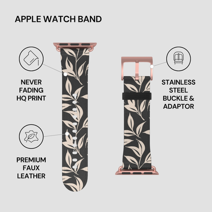 Floral patterned Apple Watch band with rose gold buckle and adapter on a light gray background