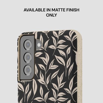 Phone case with leaf pattern on a light gray background