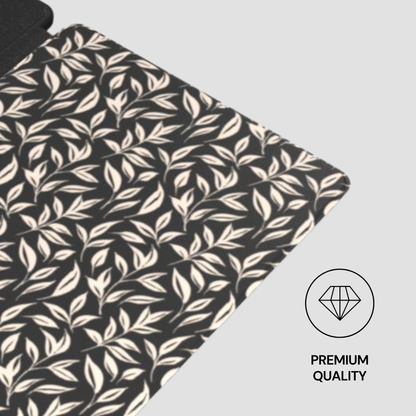 Fabric with leaf pattern on a black background, featuring a 'Premium Quality' label.