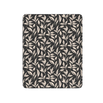 Patterned fabric with leaf design on a black background