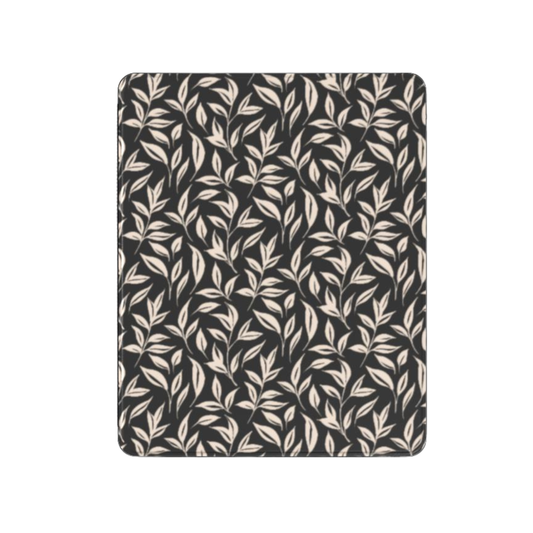 Patterned fabric with leaf design on a black background