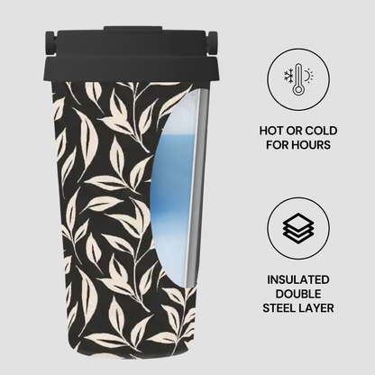 Insulated tumbler with leaf pattern on a light gray background