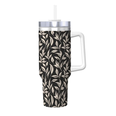 Tumbler with leaf pattern, white handle, and silver lid on a white background