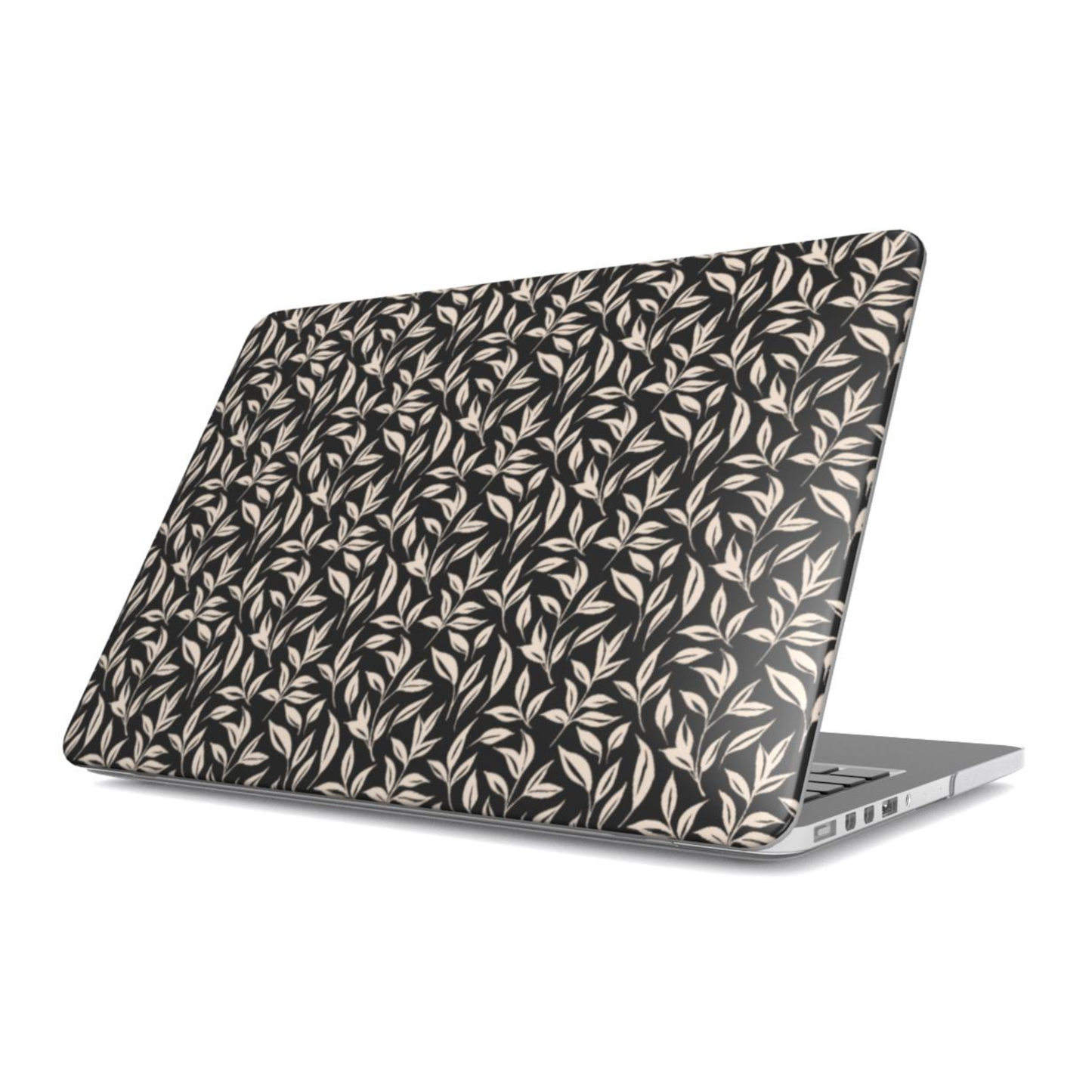 Laptop with a leaf patterned case on a white background